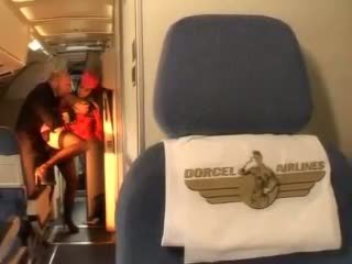 Horny stewardess rides a dick inside both holes